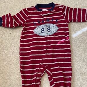 Red and gray striped footed onesie